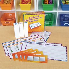 the classroom desk is full of colorful plastic bins