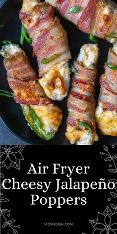 bacon wrapped cheesy jalapeno poppers are on a black plate