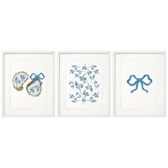 three framed pictures with blue and white designs on them, one in the shape of baby shoes