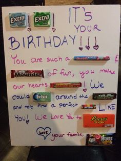 a birthday sign with candy bars on it