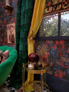 a green chair sitting in front of a window