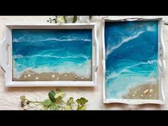 two white trays with blue and green sea glass in them