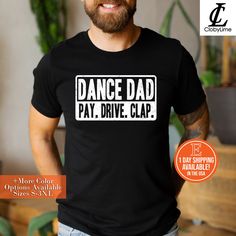 a man wearing a black shirt with the words dance dad pay drive clap on it