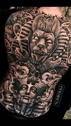 the back of a man's body with tattoos on it and an image of two faces