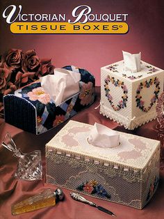 an advertisement for tissue boxes and other decorative items on a pink cloth covered tablecloth