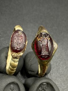 The Lot of Total 2 Beautiful Bronze Ring With Unique Intaglio Seal Stamp Engraved (Carved)On Garnet Stone A Human Figure Probably From Ancient Achaemenid Empire Civilizations. Originated From Central Asia. The Ring Intaglio Is Imprinted On Wet Clay For Better View In The Pictures . Rare Ancient Bronze Jewelry Ring . Best Item For Collections and Study . Fast and Free Shipping World Wide. Antique Carved Engraved Ring For Ceremonial Use, Traditional Ceremonial Intaglio Jewelry, Antique Intaglio Ceremonial Jewelry, Ancient Ceremonial Hallmarked Jewelry, Antique Ceremonial Intaglio Jewelry, Antique Intaglio Jewelry For Ceremonial Occasions, Oval Ceremonial Carved Jewelry, Traditional Intaglio Jewelry For Anniversary, Antique Carved Collectible Ring