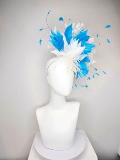 From the 2024 Featured Milliner of the Kentucky Derby Museum  Gorgeous Kentucky Derby hat fascinator  kentucky derby hat fascinator white sinamay with white feather flower and feathers with bright turquoise  blue feathers  headband attachment.  each hat is totally one of a kind! no two are alike! I can probably add feathers, flowers etc to existing hats for a small fee. I cannot remove anything from existing hats. Just message me and see if we can make it work! :) I cannot make custom order from White Feather Trim Fascinator For Races, White Fascinator With Feather Trim For Races, White Mini Hats With Feathers For Royal Ascot, White Feathered Fascinator For Races, White Feathered Headpieces For Kentucky Derby, Blue Feather Headpiece For Summer, White Feathered Mini Hats For Races, Blue Feathered Headpieces For Summer, Blue Feathered Summer Headpieces