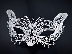 Embark on an enchanting journey with our white couples masquerade mask set featuring a stunning laser-cut metal fox mask adorned with rhinestones for her, and a powerful wolf mask for him. Together, you'll create an unforgettable duo at any masquerade party, ball, and other elegant events! Age Group/Gender - Adult/Unisex Size/Type - One size fits all adults Mask Color - White Mask Material - Laser-cut metal fox, polyresin wolf Accent Material - Paint Special Features - Rhinestones on the women's Fox Masquerade Mask, White Masquerade Mask, White Masquerade, Mask Masquerade Ball, Masquerade Mask Women, Phantom Mask, Masquerade Ball Masks, Couples Masquerade Masks, Masquerade Outfit