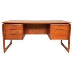 a wooden desk with two drawers on one side and an open drawer on the other