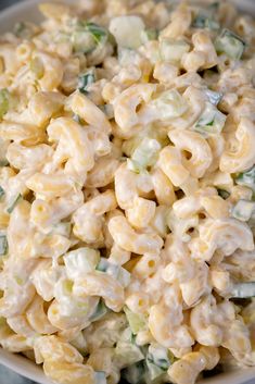 macaroni and cheese salad in a white bowl