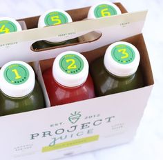 six bottles of juice are in a box