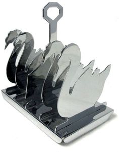 a set of five knives sitting on top of a metal holder