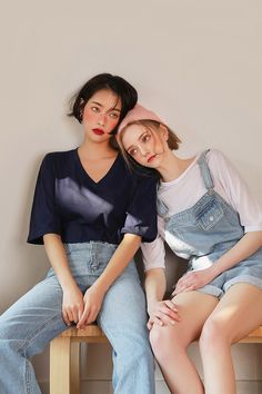 two young women sitting next to each other