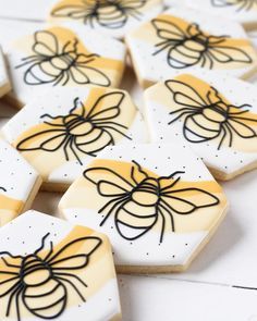 some cookies that have been decorated to look like honeybees on top of each other