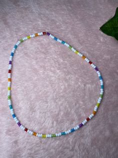 White and Rainbow Seed Bead Necklace Trendy White Jewelry With Large Beads, Casual White Beaded Necklaces With Large Beads, Casual White Beaded Necklace With Large Beads, Casual White Beaded Necklaces With Tiny Beads, Trendy White Necklace With Letter Beads, Trendy White Beaded Chain Necklace, Trendy White Beaded Necklace, Casual White Beaded Necklaces, Casual White Beaded Bracelets