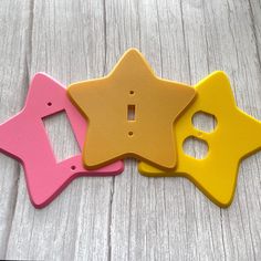 three little star shaped magnets sitting next to each other