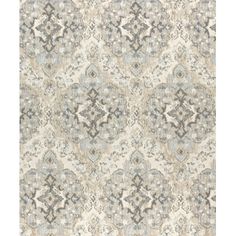 an area rug with grey and white designs on it