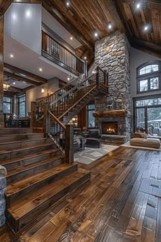 a living room filled with furniture and a fire place next to a stone wall covered in windows