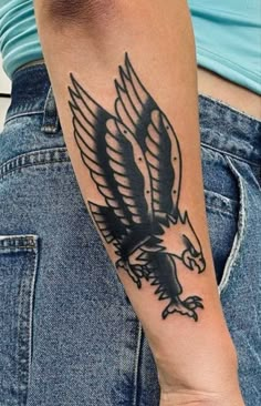 an eagle tattoo on the arm