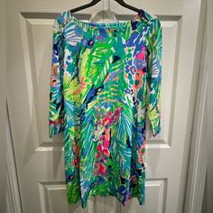 Lilly Pulitzer Sophie Upf 50+ Dress Color: Multi - Purrfect New With Tags 3/4 Length Sleeves. Boatneck With Gold Button Detail On Shoulders And Cuffs. 93% Rayon, 7% Spandex Fabric Provides Upf 50+ Protection. Smoke Free Home Perfect Condition. Casual Multicolor Dress With 3/4 Sleeves, Green 3/4 Sleeve Dresses For Brunch, Green Beach Dress With 3/4 Sleeves, Green 3/4 Sleeve Dress For Vacation, Green Dress With 3/4 Sleeves For Vacation, Green Summer Dress With 3/4 Sleeves, 50 Dress, Lilly Pulitzer Dress, 50's Dress