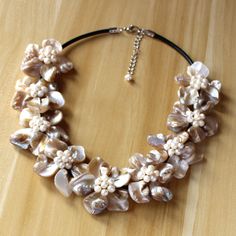 "Material: shell, FW pearl, lobster clasp,Leather rope Bead size: 6-7-8mm, 13*18mm,15*20mm Necklace size: 18\" + 2\" extension chain Color: Colorful Packing: Beautiful Pouch All items in my shop are made to order. . Most of the time it takes 1-3 business days but can be longer at times and for larger orders. If you want to order of different style. Please contact me . ----------------------------------------------------- Please feel free to convo me should you have any question! Thank you! :)" Adjustable Pearl Flower Necklace Elegant Style, Elegant Shell Necklaces For Wedding, Adjustable Elegant Pearl Necklace, Elegant Pearl Necklace With Shell And Pearl Charm, Elegant Pearl Charm Shell Necklace, Elegant Adjustable Shell Pearl Necklace, Elegant Shell Pearl Necklace With Pearl Charm, Elegant Adjustable Pearl Flower Necklace, Adjustable Elegant Pearl Flower Necklace