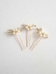 FRESHWATER PEARL WEDDING HAIR PINS These pretty sparkly pins are handcrafted using crystals and genuine freshwater pearls. They are available in silver or gold metal with cream colored pearls. They work beautifully in up-dos, braids or buns and you can use additional bobby pins to secure them into your hair, if you are wearing your hair down you can request that they be made with a small alligator clip or comb. The listing is for clear crystals, but I do have other crystal colors including gold Wedding Hair Pins Crystal, Pearl Hair Pin Wedding, Pearl Wedding Hair, Pearl Bridal Hair, Bridal Hair Pins Pearl, Colored Pearls, Wedding Hair Jewelry, Crystal Colors, Pearl Bridal