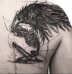 a man's back with a skeleton and wings tattoo on his upper half sleeve