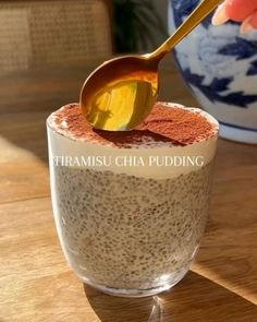 there is a spoon in a cup with chia pudding