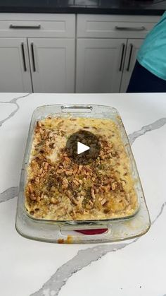 a casserole dish is sitting on a kitchen counter