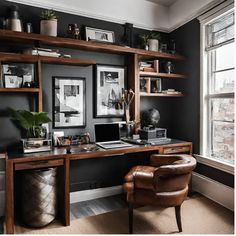 a home office with black walls and wooden shelving, leather chair, and desk