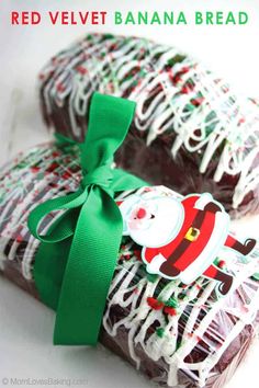 red velvet banana bread with santa clause on top and green ribbon tied around the edges