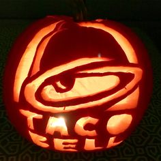 a carved pumpkin with the word taco bell on it