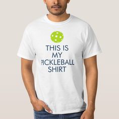 a man wearing a white t - shirt with the words, this is my pickleball shirt