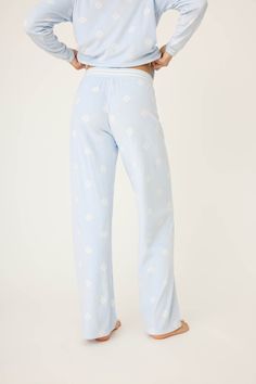 Welcome winter in lounge pants featuring an adorable white snowflake print. Crafted from soft velour fabric, these pants offer ultimate comfort for lounging or sleeping. The tie waist allows for a customizable fit, ensuring you can relax in style. With a charming snowflake pattern and a soothing pale blue hue, these pajama pants are perfect for cozy winter nights and holiday mornings! Blue Whisper, Welcome Winter, Snowflake Print, Nye Outfits, Velour Pants, Velour Fabric, Winter Nights, White Snowflake, Snowflake Pattern