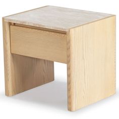 a small wooden table sitting on top of a white floor