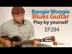 a man playing a guitar with the words boogie woogie blues guitar play by yourself