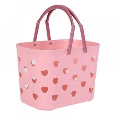 a pink shopping bag with hearts on the front and sides, sitting against a white background