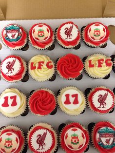 the cupcakes are decorated in red, white and blue with liverpool crests on them