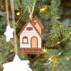 a wooden ornament hanging from a christmas tree