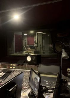 an empty recording studio with sound equipment