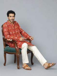 VASTRAMAY Men's Red Patola Print Ethnic Kurta Pyjama Set Elevate your ethnic wear collection with this classic kurta pyjama set. Features a red Patola print kurta with a mandarin collar, full sleeves, and knee length. Paired with comfortable cream colored viscose pants with an elasticated waistband. Perfect for festive occasions and family gatherings. Key Features Red Patola print ethnic kurta Mandarin collar Full sleeves Knee length Cream colored viscose pyjama Elasticated waistband Specificati Traditional Red Bandhgala With Long Sleeves, Traditional Red Long Sleeve Bandhgala, Red Traditional Long Sleeve Bandhgala, Red Long Sleeve Traditional Bandhgala, Red Sherwani With Traditional Patterns For Festivals, Cotton Sherwani With Traditional Patterns, Cotton Long Sleeve Bandhgala For Navratri, Long Sleeve Cotton Bandhgala For Navratri, Cotton Bollywood Bandhgala With Long Sleeves