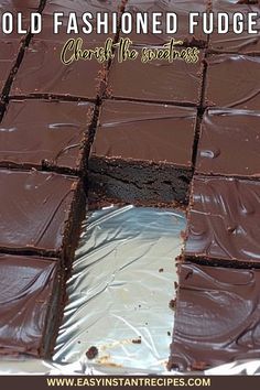 there is a piece of chocolate cake that has been cut into squares and placed on foil