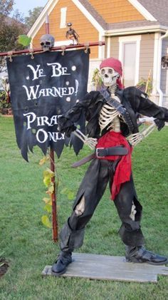 a skeleton dressed in pirate clothing holding a sign