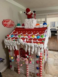 a house made out of candy canes and christmas decorations