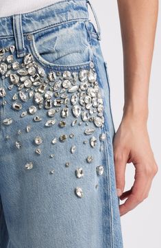 Hand-sewn jewels cascade from the front pockets on these high-waisted jeans crafted from lightweight denim in a wide-leg silhouette. 32" inseam; 25" leg opening; 12 1/4" front rise; 15" back rise (size 29) Zip fly with button closure Five-pocket style 61% cotton, 39% Tencel® lyocell Tencel lyocell is a more-sustainably produced fiber made with closed-loop processing Hand wash, line dry Imported Eras Tour Jeans, Bedazzled Clothes, Bejeweled Jeans, Coachella Costume, Decorated Jeans, Diamond Jeans, Jean Jacket Design, Chain Jeans, Bedazzled Jeans