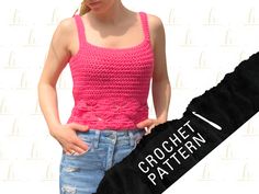 a woman in pink shirt standing next to a black object with the word crochet pattern on it