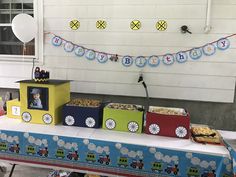 a train themed birthday party with food and decorations