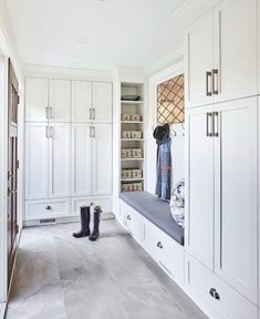 the instagram page shows an image of a walk in closet with white cabinets and black boots