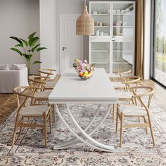 a dining room table with chairs around it