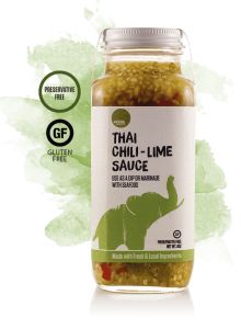 thai cucumber sauce in a glass jar with an elephant on the front and green leaves behind it